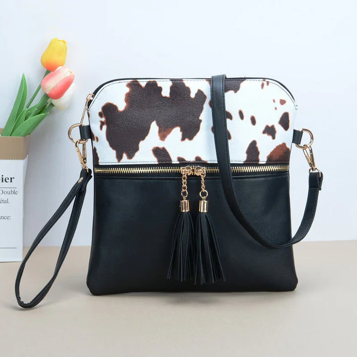 Tiffany - crossbody tas met kwastjes en koeienprint