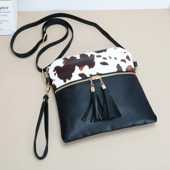 Tiffany - crossbody tas met kwastjes en koeienprint