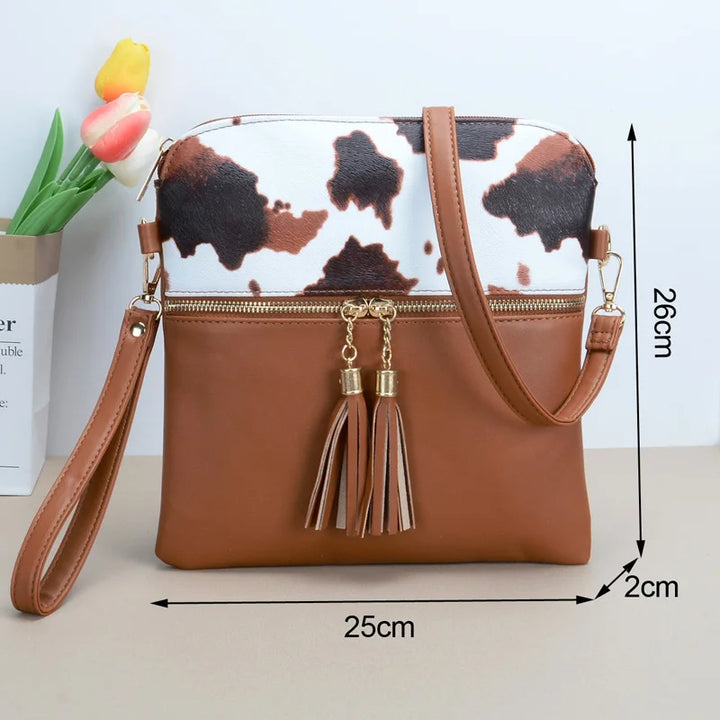 Tiffany - crossbody tas met kwastjes en koeienprint